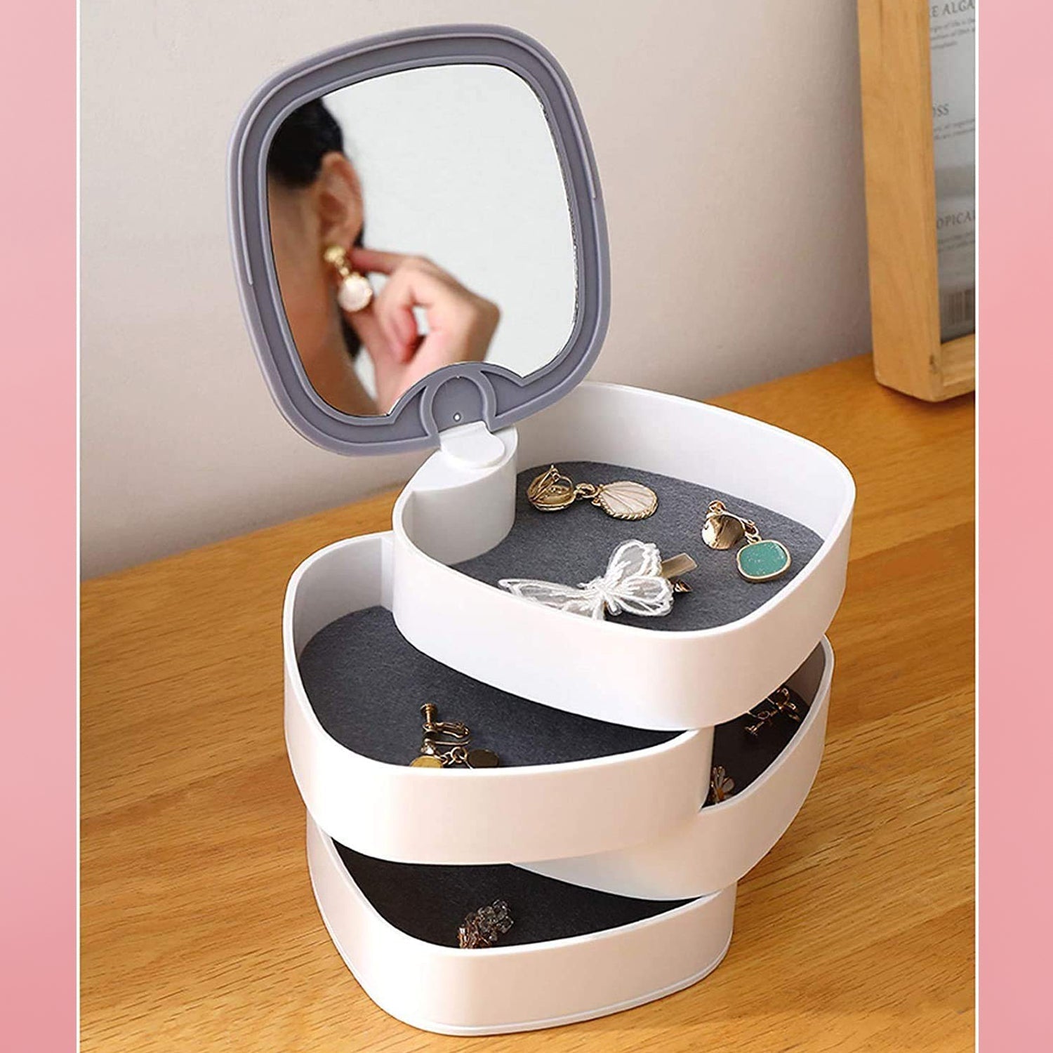 Top view of rotating jewelry box with 4 layers and mirror Top view of rotating jewelry box with 4 layers and mirror